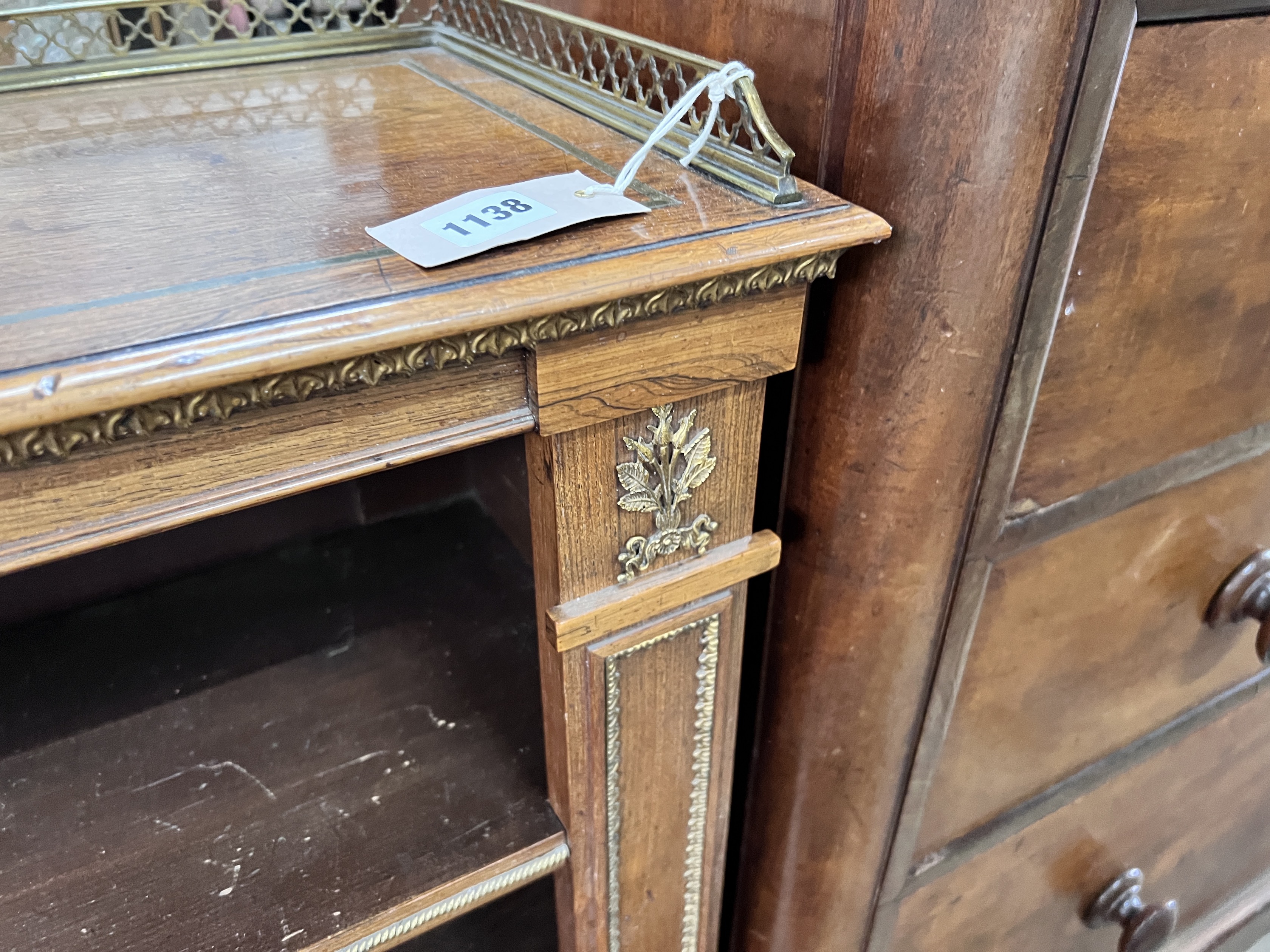 A Regency style giltwood metal mounted rosewood open bookcase, width 111cm, depth 30cm, height 90cm